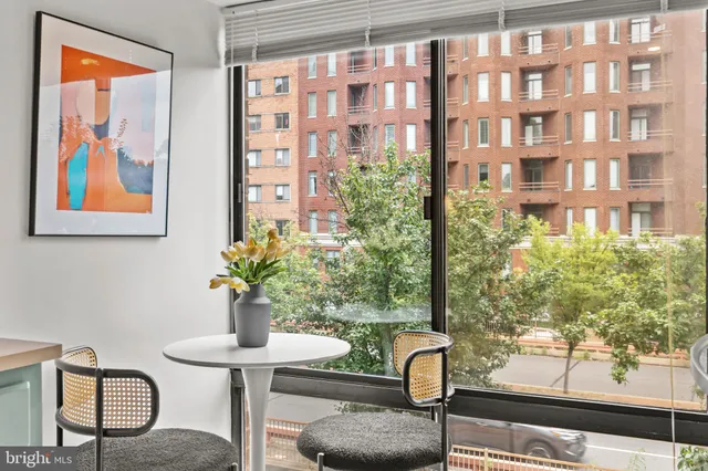 a close view of a utility room with dryer and washer