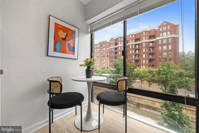 a bedroom with a bed and painting on the wall