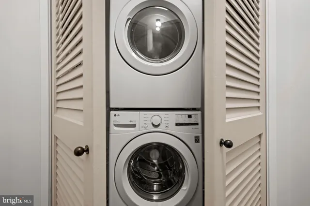 a bedroom with a large bed and a large window