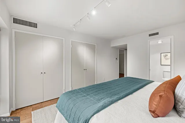 a bathroom with a sink mirror and toilet