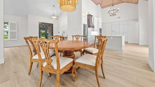 a dining room with furniture and wooden floor