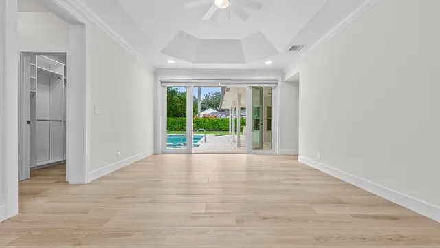 a view of an entryway with wooden floor