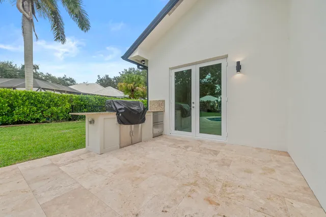 an aerial view of residential house with outdoor space and swimming pool