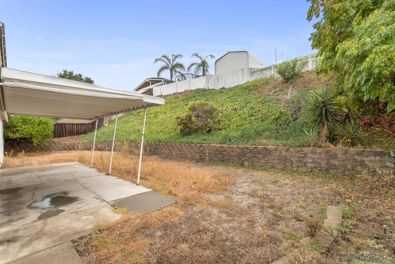 8715 Vista Del Verde El Cajon, CA 92021 - Photo 24 of 30 a backyard of a house with lots of green space