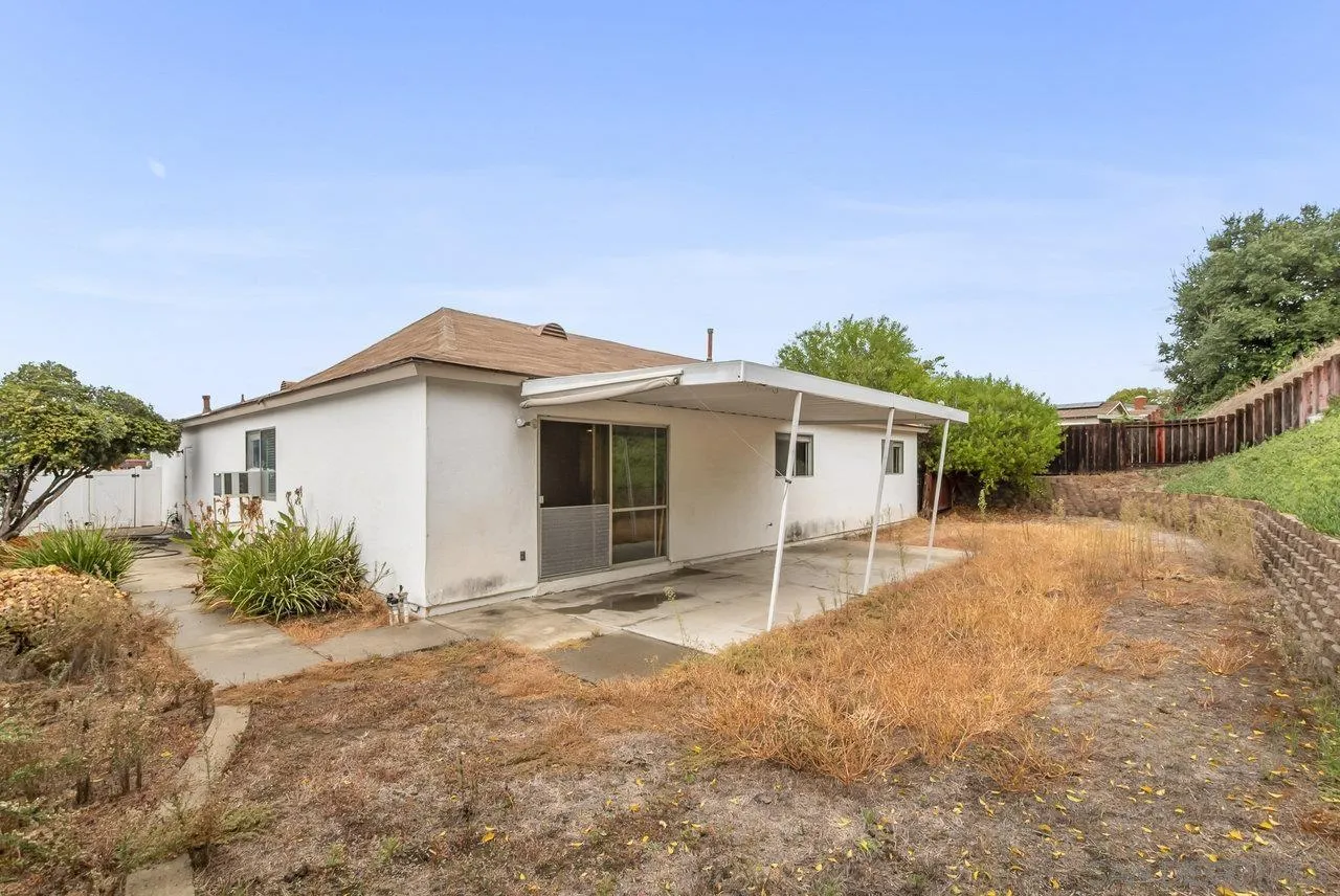 8715 Vista Del Verde El Cajon, CA 92021 - Photo 25 of 30 a view of a house with a yard and potted plants