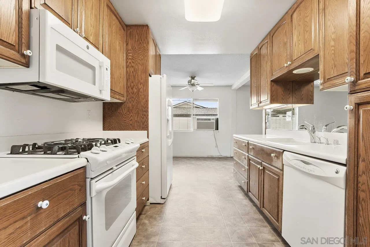 8715 Vista Del Verde El Cajon, CA 92021 - Photo 3 of 30 a kitchen with stainless steel appliances granite countertop a stove and a sink