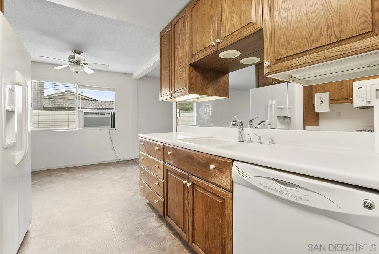 8715 Vista Del Verde El Cajon, CA 92021 - Photo 4 of 30 a kitchen with a sink and a refrigerator
