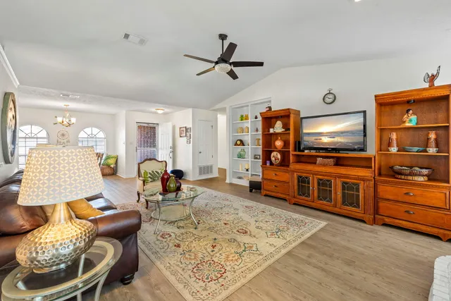 a living room with furniture a rug and a fireplace