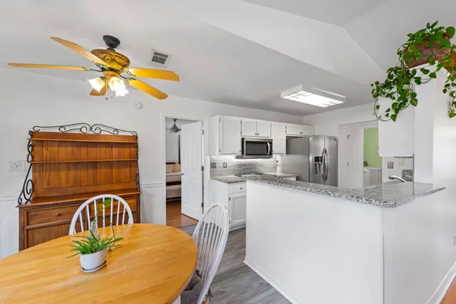 a view of a dining room with furniture window and outside view