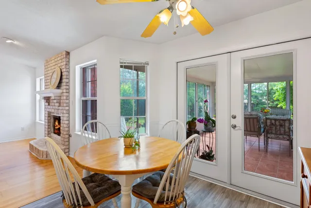 a view of a patio with a dining table and chairs