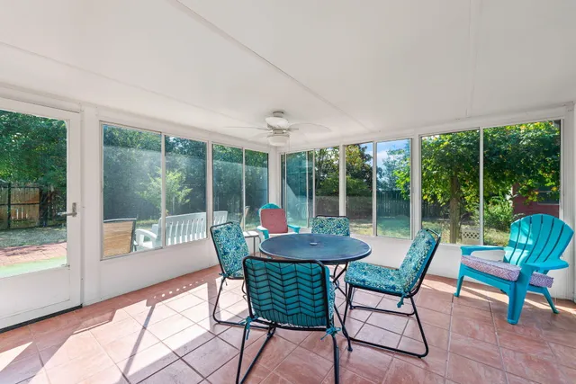 a spacious bathroom with a double vanity sink a mirror a vanity and a shower