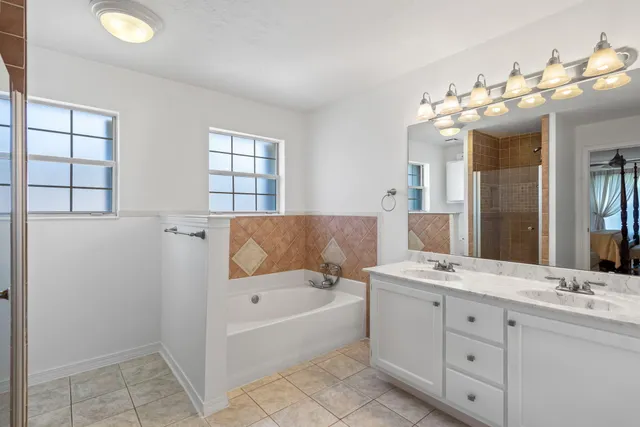 a bedroom with bed and window