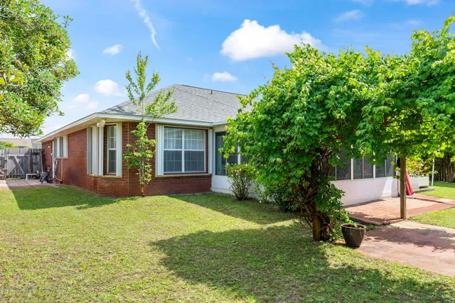 an outdoor space with furniture and garden
