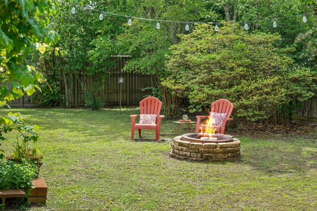 an aerial view of residential houses and lake