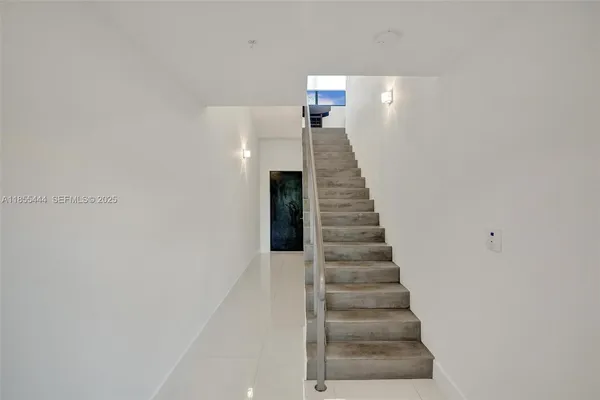 a kitchen with granite countertop a stove and a refrigerator