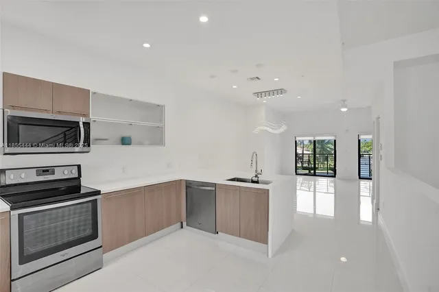 wooden floor in an empty room with windows