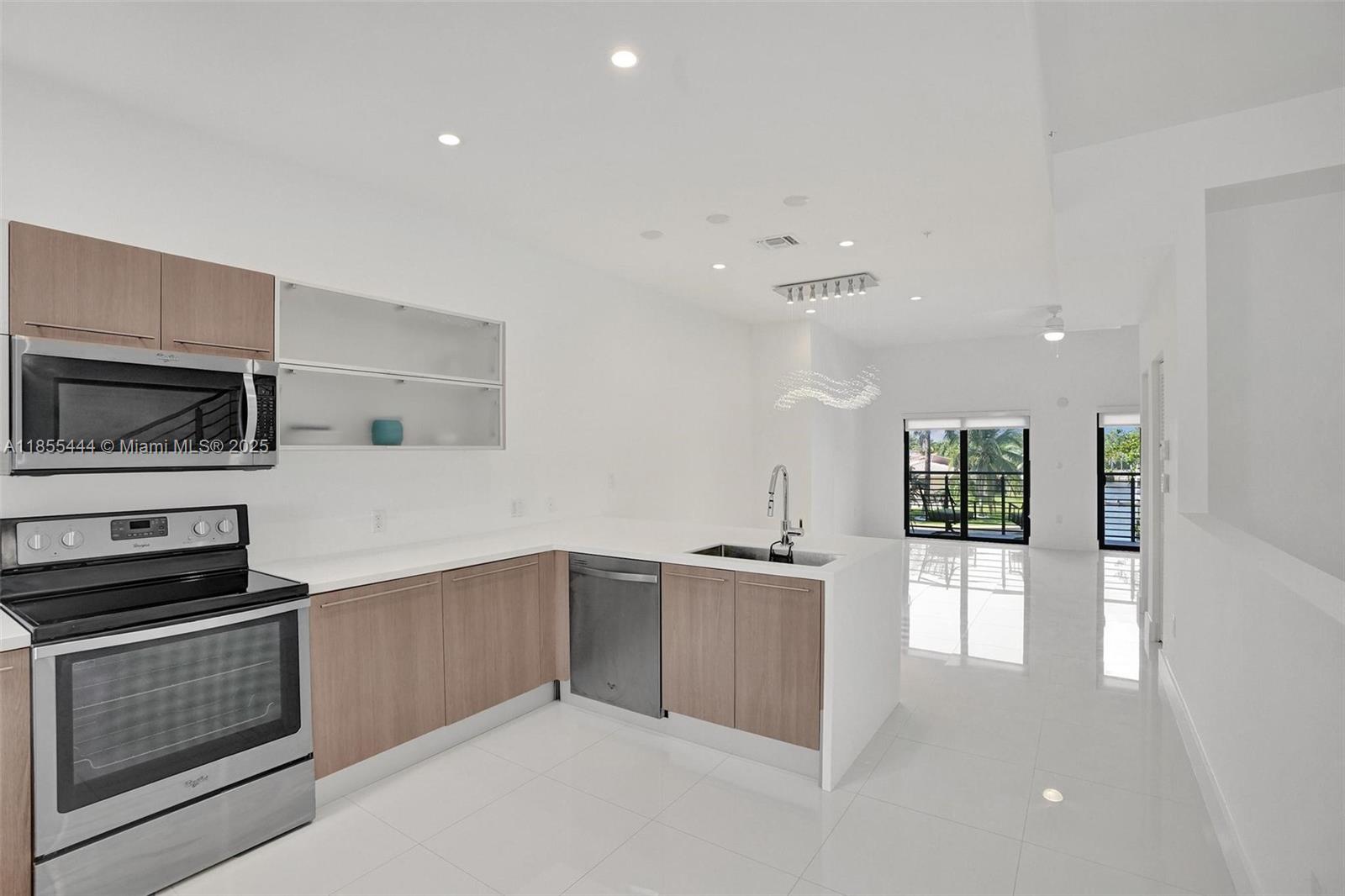 516 Southeast 1st Circle Pompano Beach, FL 33060 - Photo 15 of 81 a kitchen with granite countertop a stove and a refrigerator