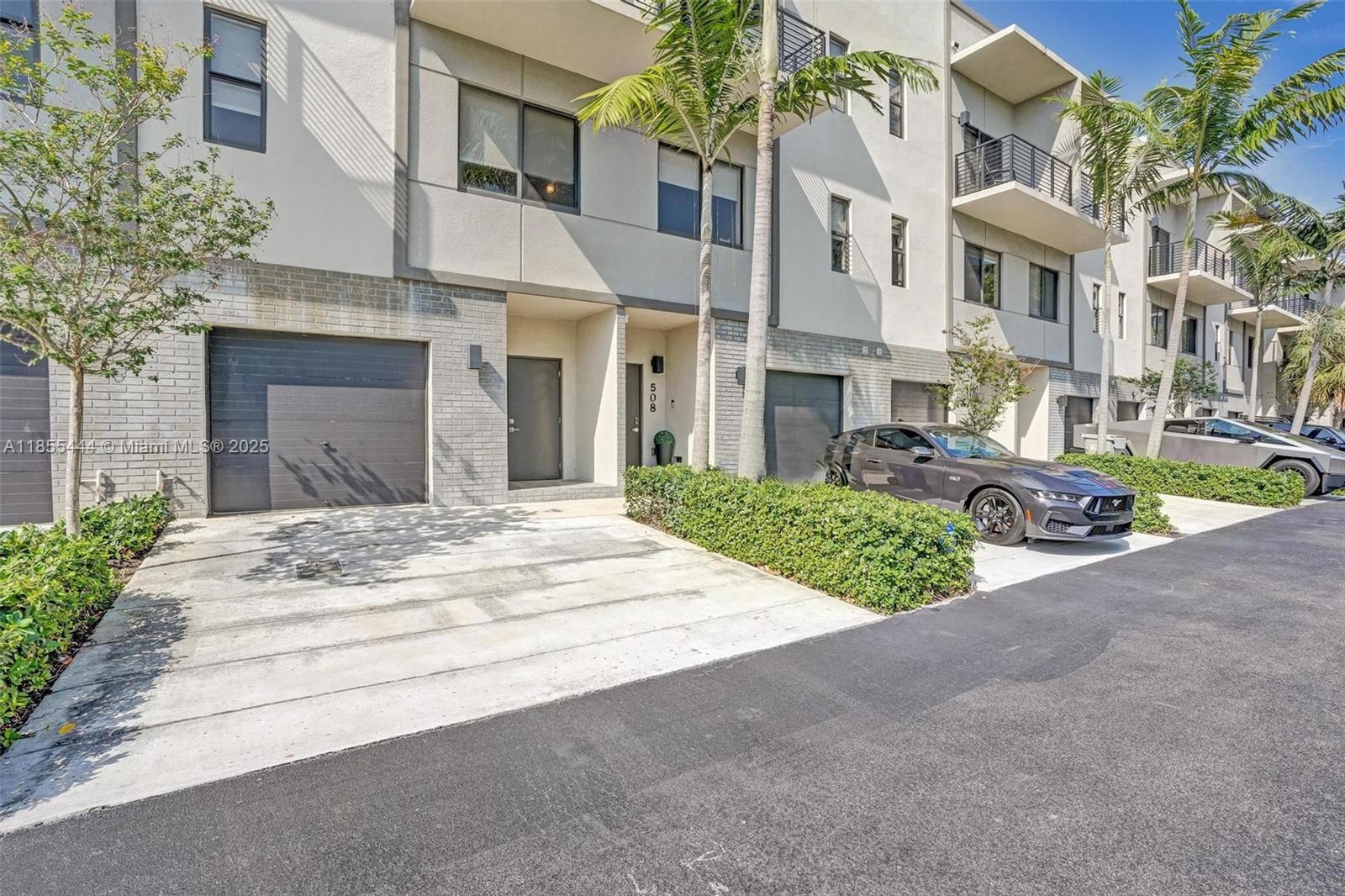 516 Southeast 1st Circle Pompano Beach, FL 33060 - Photo 2 of 81 a view of a building with a street