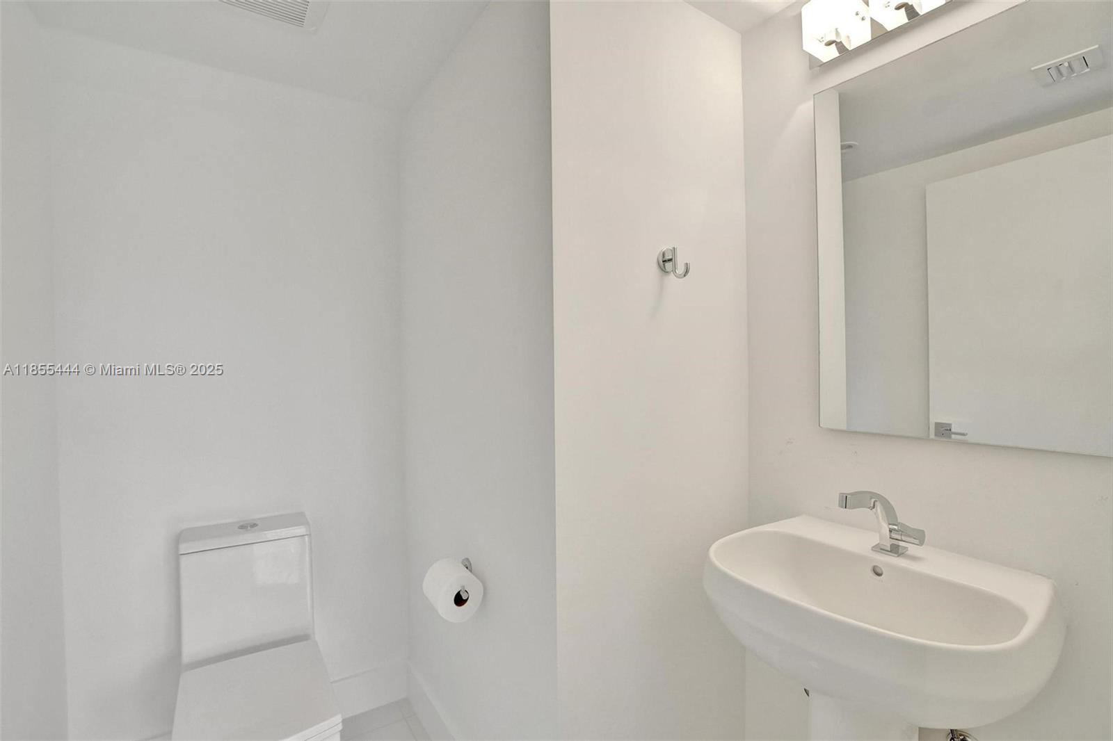 516 Southeast 1st Circle Pompano Beach, FL 33060 - Photo 26 of 81 a bathroom with a sink and a mirror