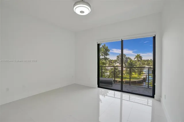 a view of a hallway with washer and dryer