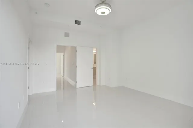 a close view of a utility room with dryer and washer
