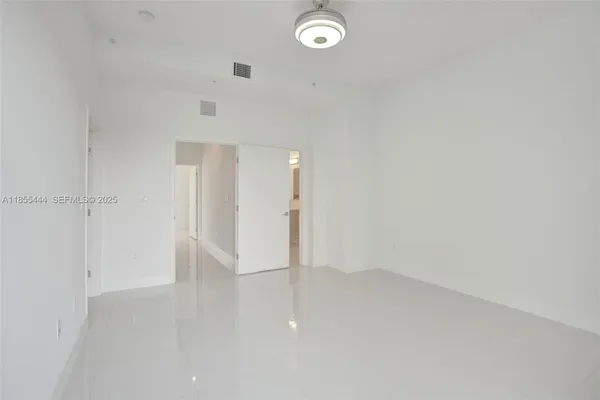 a view of a hallway with washer and dryer