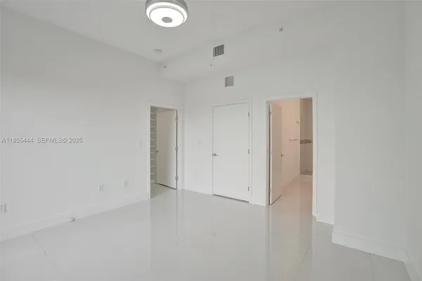 a close view of a utility room with dryer and washer