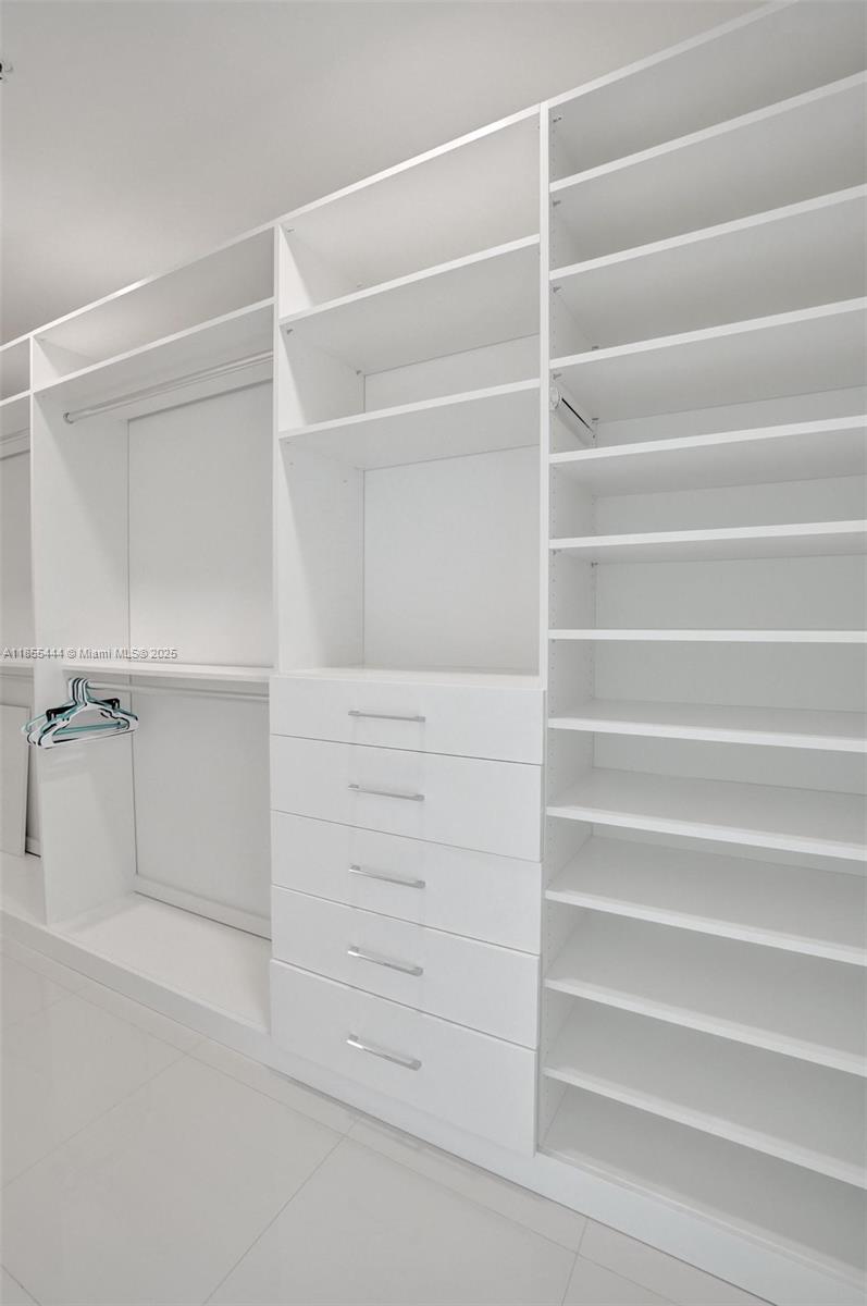 516 Southeast 1st Circle Pompano Beach, FL 33060 - Photo 38 of 81 a view of walk in closet with empty racks