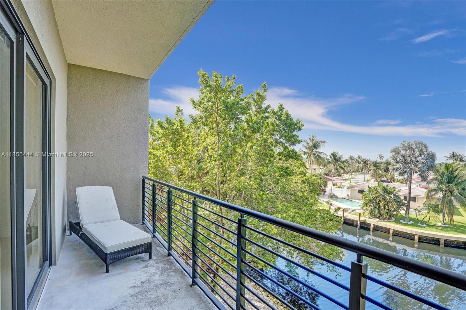 516 Southeast 1st Circle Pompano Beach, FL 33060 - Photo 46 of 81 a view of a chair and table in the balcony