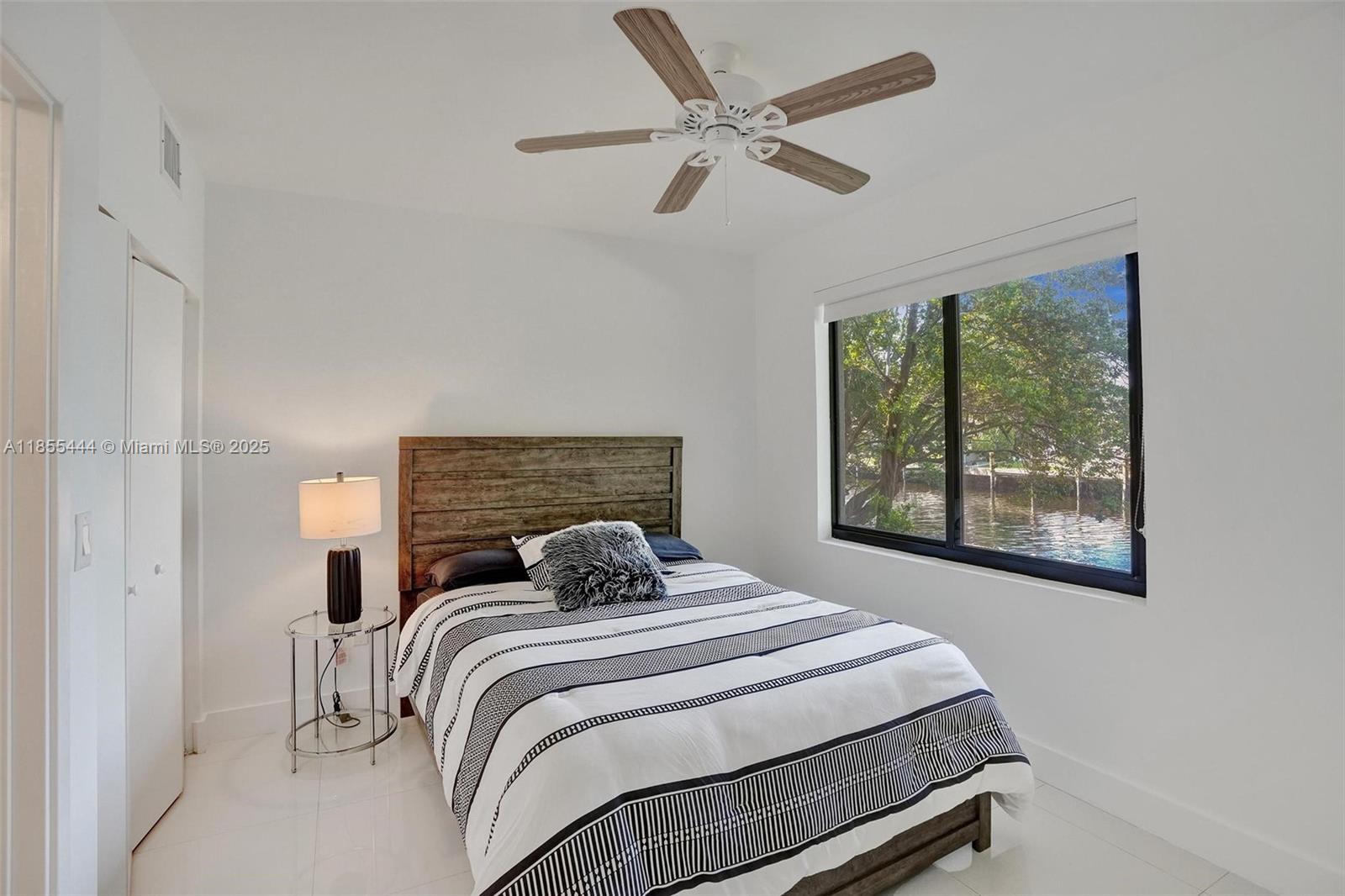 516 Southeast 1st Circle Pompano Beach, FL 33060 - Photo 5 of 81 a bedroom with a bed and a window