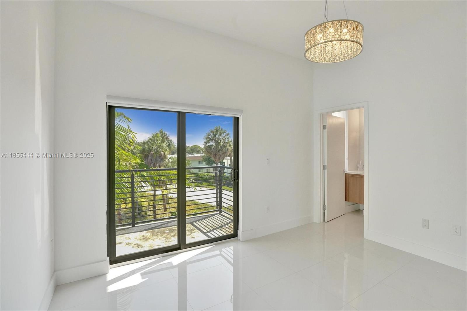 516 Southeast 1st Circle Pompano Beach, FL 33060 - Photo 55 of 81 an empty room with a chandelier