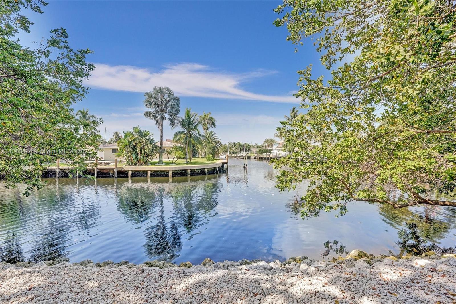 516 Southeast 1st Circle Pompano Beach, FL 33060 - Photo 62 of 81 a view of a lake with houses in the back