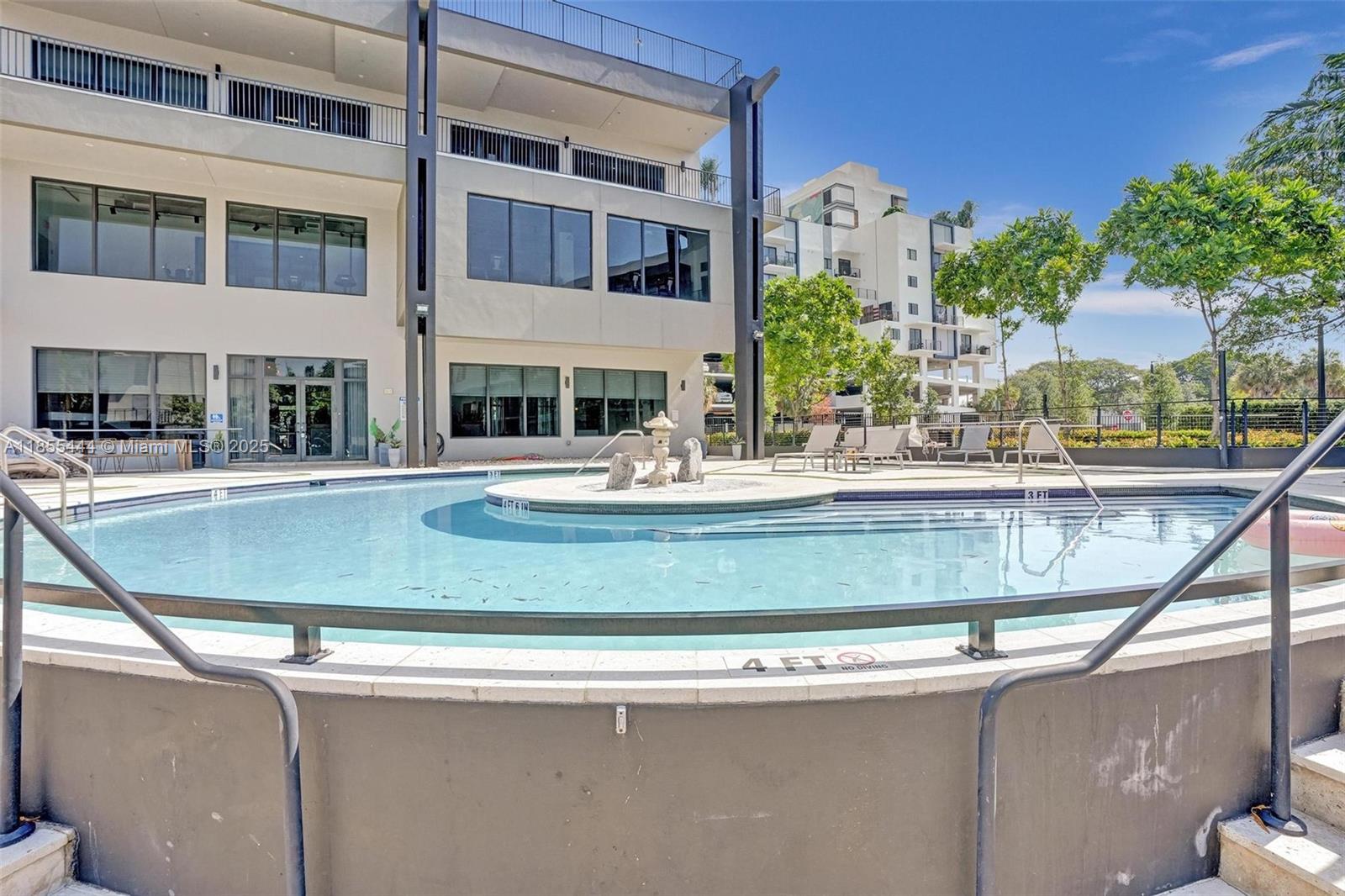 516 Southeast 1st Circle Pompano Beach, FL 33060 - Photo 70 of 81 a view of building with large windows and palm trees