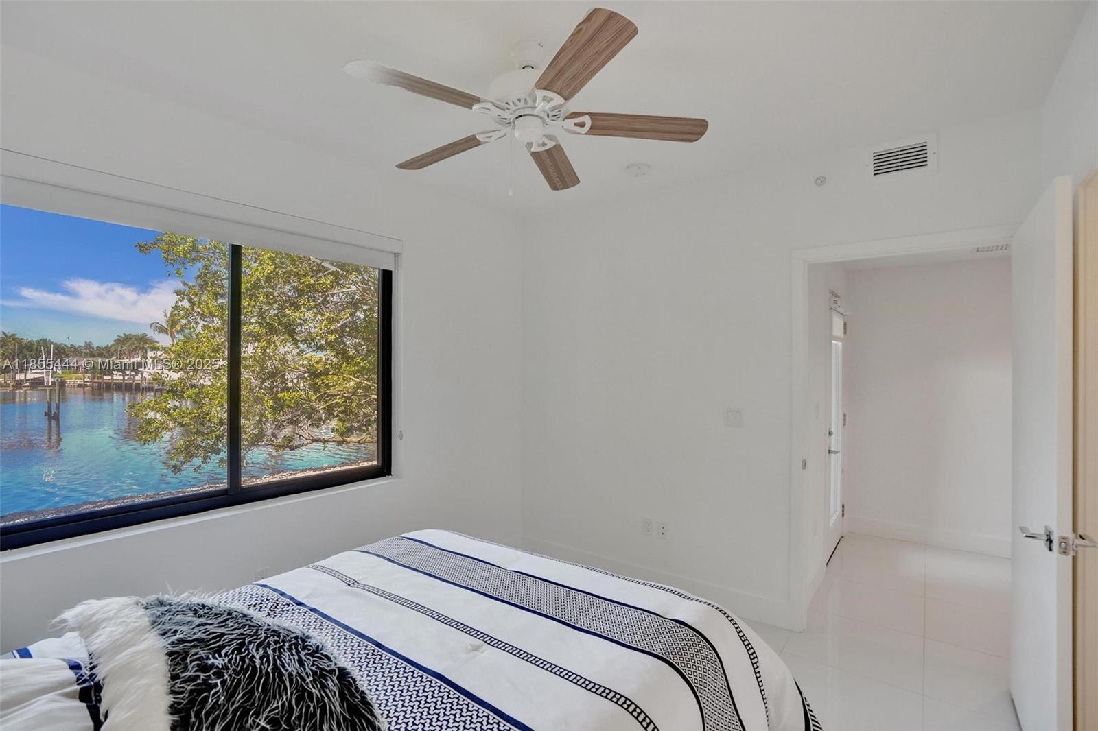 516 Southeast 1st Circle Pompano Beach, FL 33060 - Photo 7 of 81 a bedroom with a bed and a window