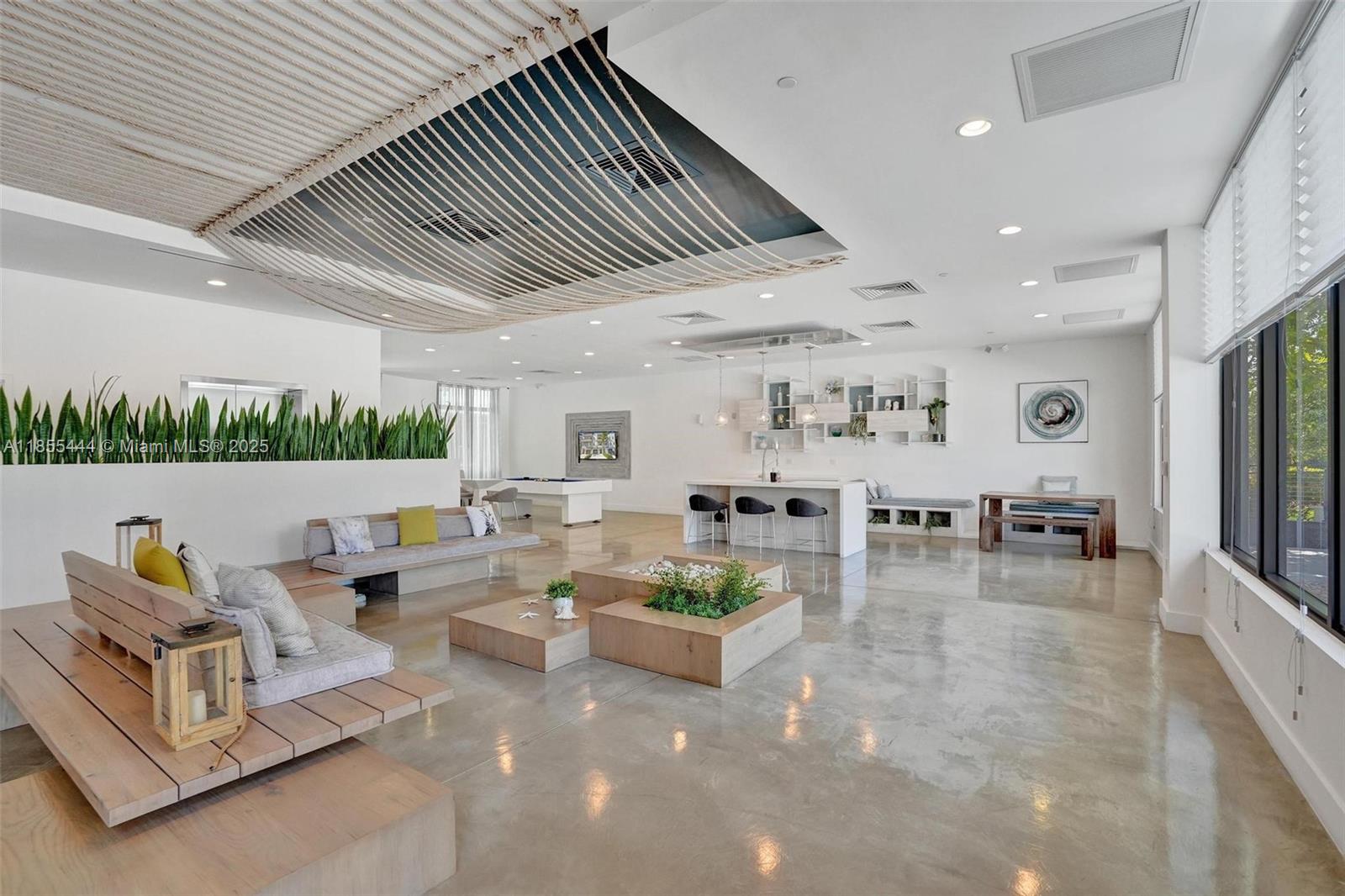 516 Southeast 1st Circle Pompano Beach, FL 33060 - Photo 72 of 81 a living room with lots of white furniture and a table