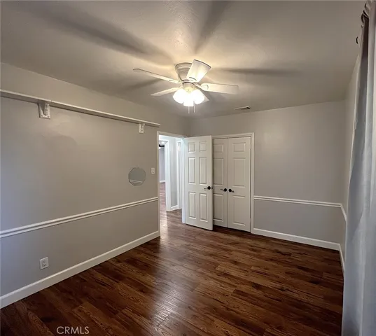 a bathroom with a sink a toilet a mirror and bathtub