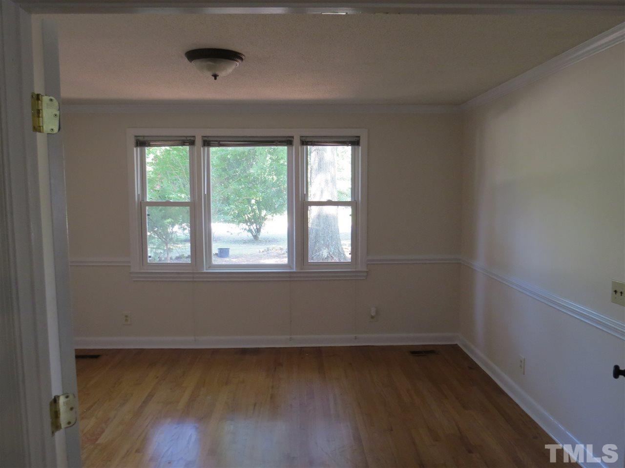 741 Colonial Drive Raleigh, NC 27603 - Photo 14 of 17 a view of a hardwood floor in a room