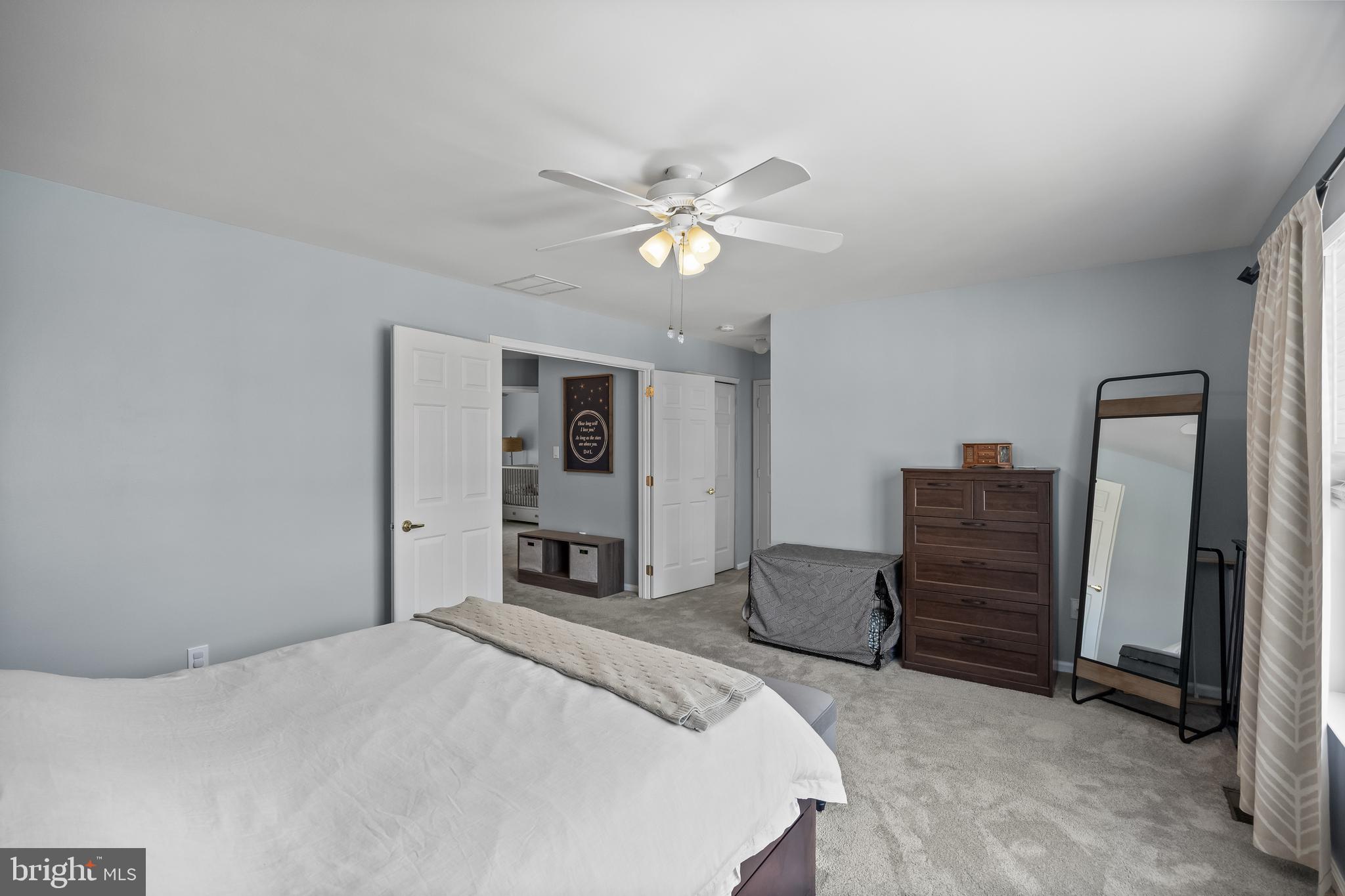 14 Vassar Road Mount Laurel, NJ 08054 - Photo 22 of 41 a bedroom with a bed and a chandelier