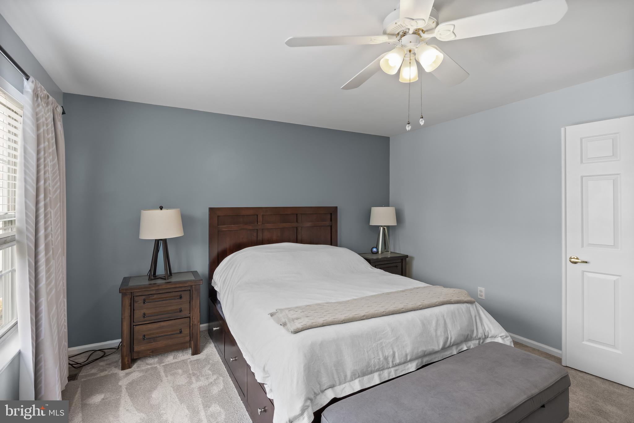 14 Vassar Road Mount Laurel, NJ 08054 - Photo 23 of 41 a bedroom with a bed and a chandelier