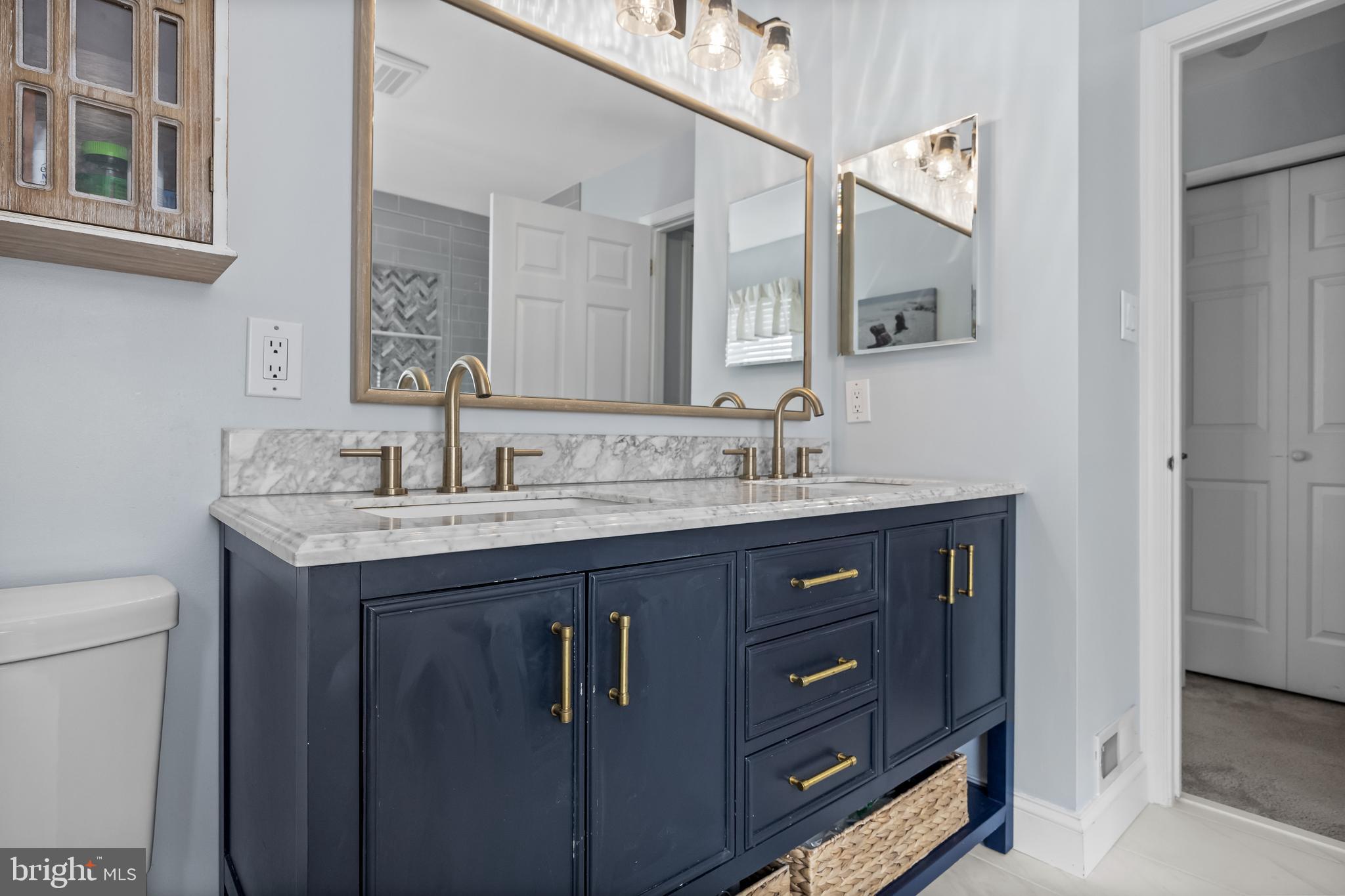 14 Vassar Road Mount Laurel, NJ 08054 - Photo 25 of 41 a bathroom with a vanity a sink and a mirror