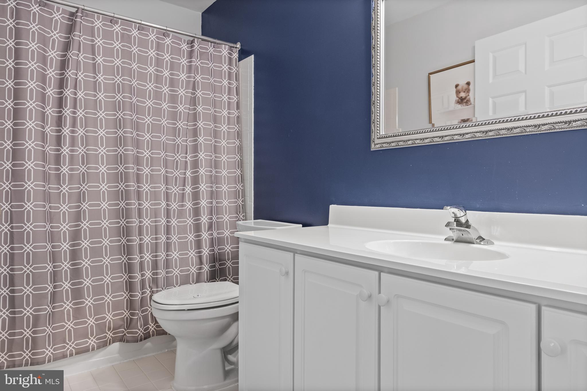 14 Vassar Road Mount Laurel, NJ 08054 - Photo 30 of 41 a bathroom with a sink a toilet and a mirror