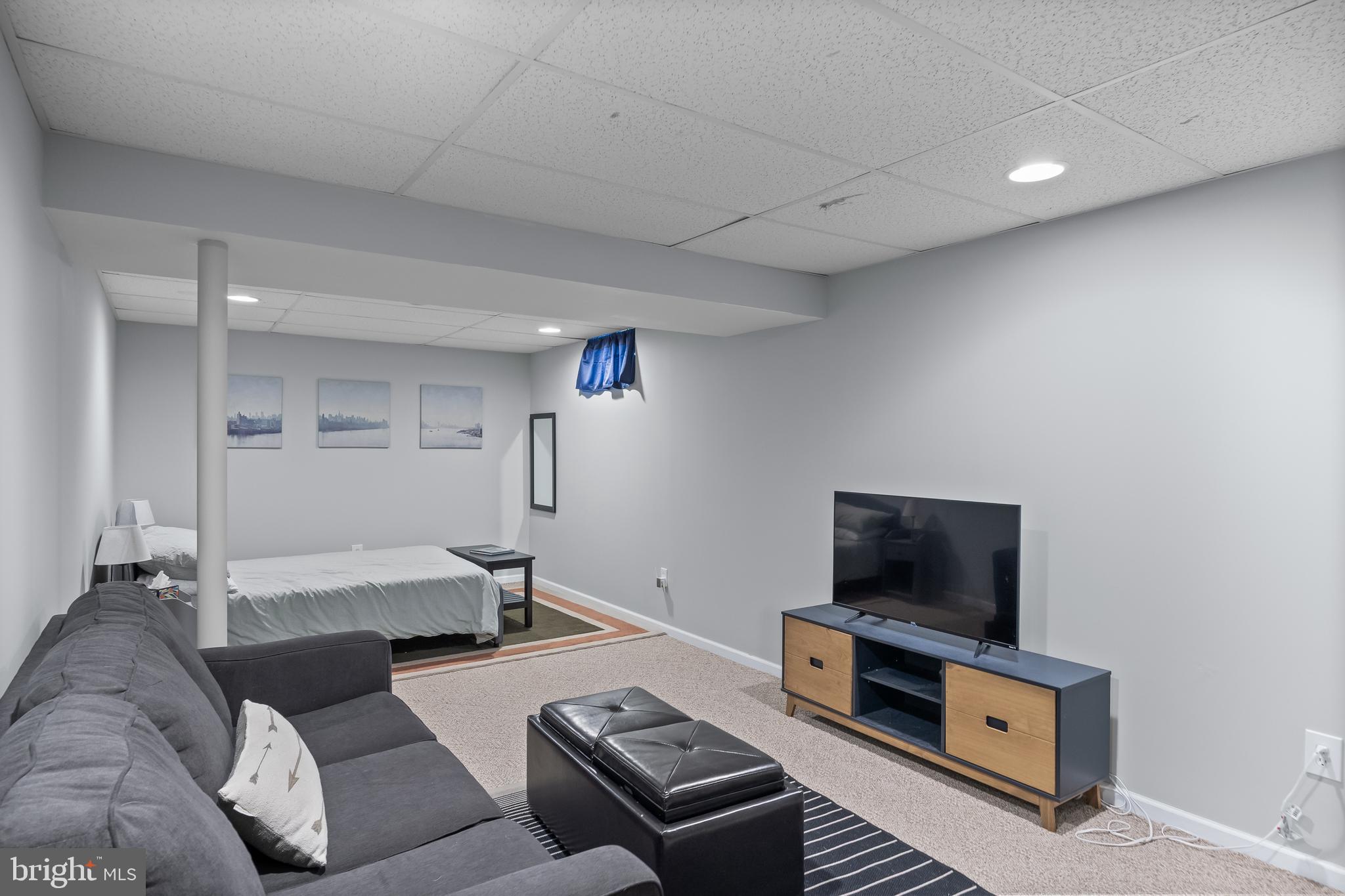 14 Vassar Road Mount Laurel, NJ 08054 - Photo 32 of 41 a living room with furniture and a flat screen tv