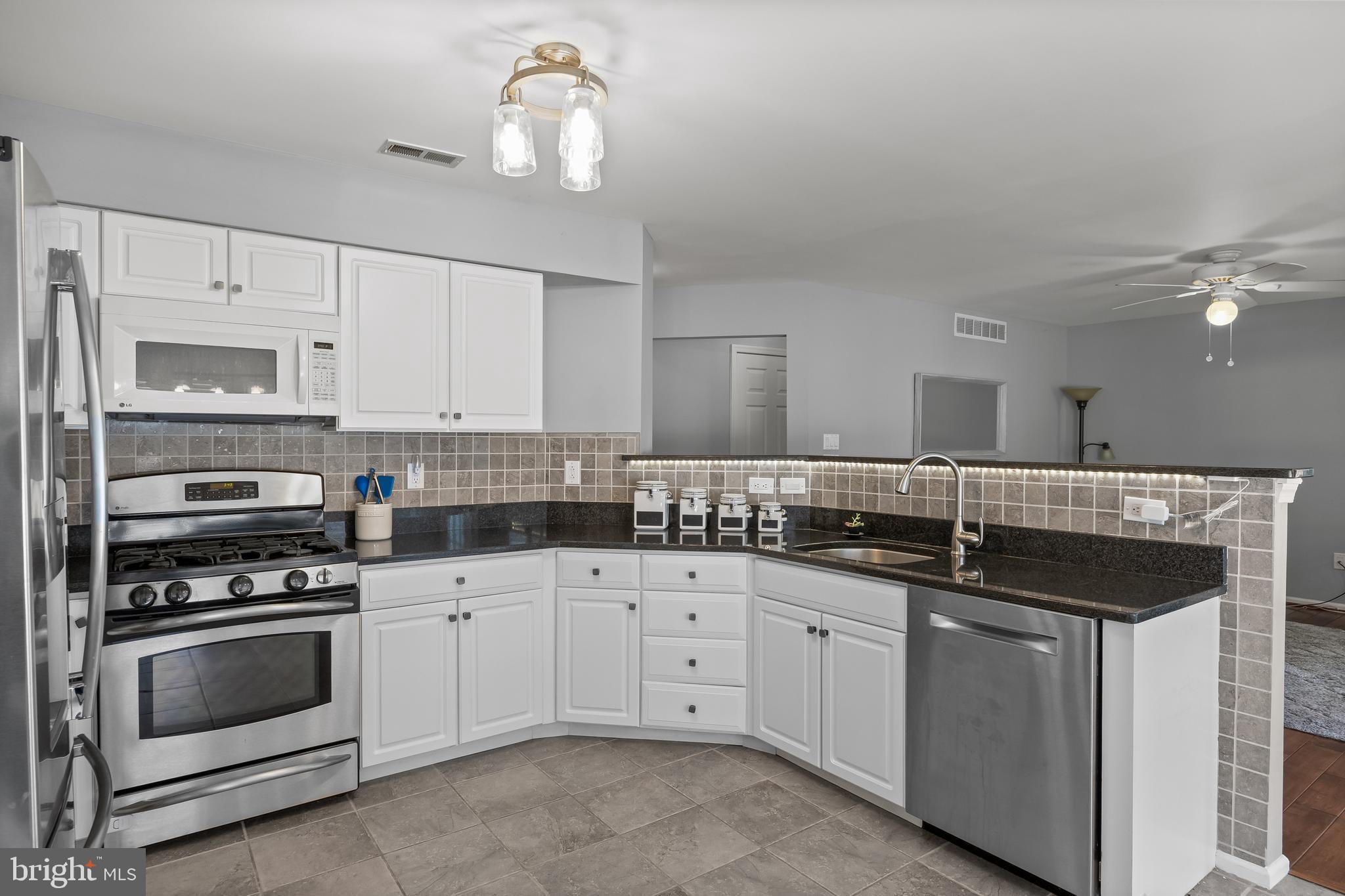 14 Vassar Road Mount Laurel, NJ 08054 - Photo 9 of 41 a kitchen with a sink stove and cabinets