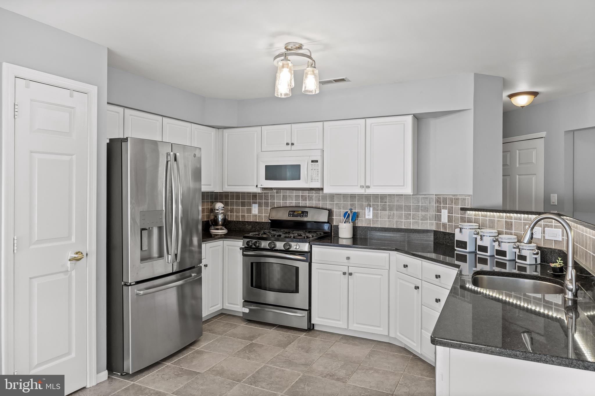 14 Vassar Road Mount Laurel, NJ 08054 - Photo 10 of 41 a kitchen with stainless steel appliances granite countertop a refrigerator sink and stove