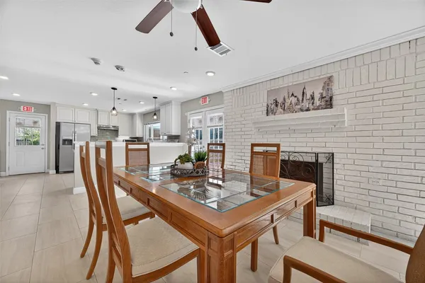 a dining room with furniture and window