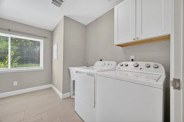 a utility room with dryer and washer