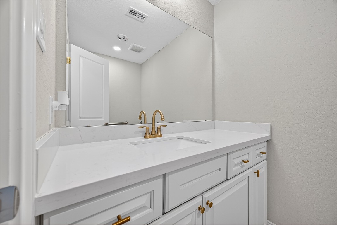29902 East Hawthorne Drive Spring, TX 77386 - Photo 18 of 43 a bathroom with a sink and vanity