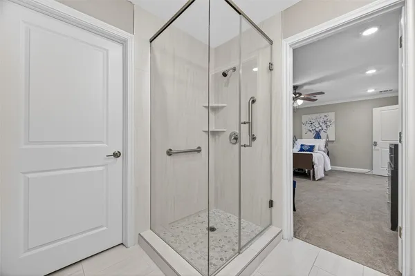 a view of a bathroom with a glass door shower