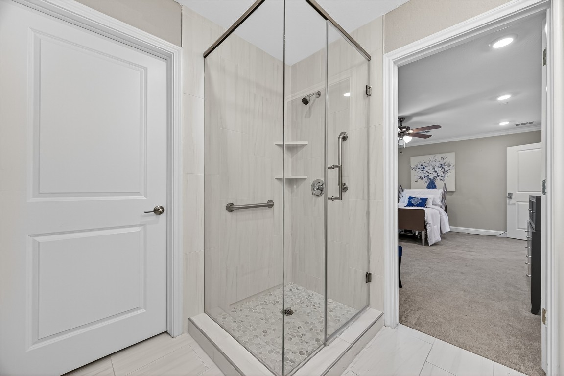 29902 East Hawthorne Drive Spring, TX 77386 - Photo 22 of 43 a view of a bathroom with a glass door shower