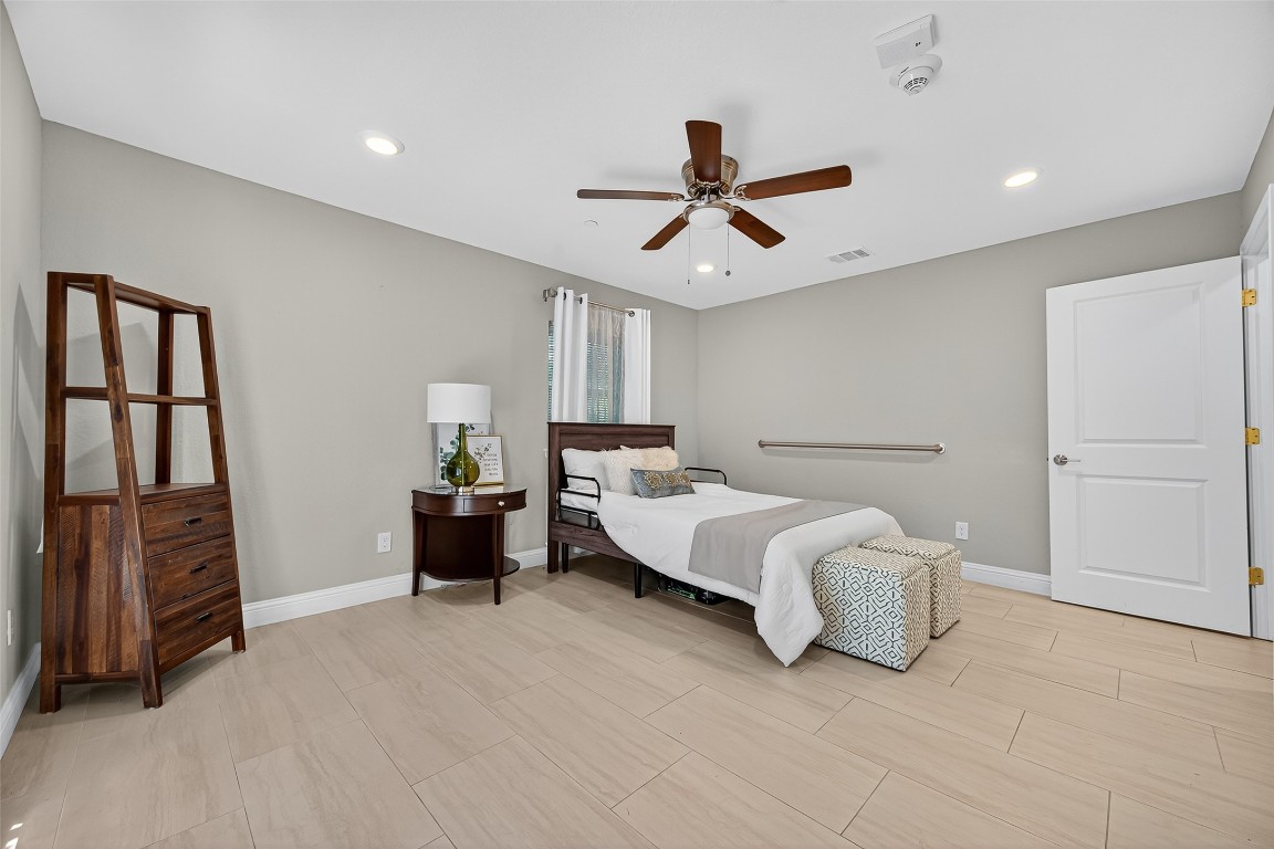 29902 East Hawthorne Drive Spring, TX 77386 - Photo 25 of 43 a spacious bedroom with a bed and a walk in closet